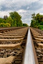 Close-up of railroad tracks leading straight foreward to infinity Royalty Free Stock Photo