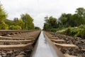 Close-up of railroad tracks leading straight foreward to infinity Royalty Free Stock Photo