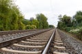 Close-up of railroad tracks leading straight foreward to infinity Royalty Free Stock Photo