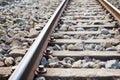 close-up of a railway track detail with grit stones Royalty Free Stock Photo