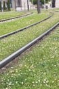 Close up of railway tracks turn on green lawn grass in springtime, bilbao, spain Royalty Free Stock Photo