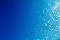 Close up rain water drops on blue sponge surface as abstract background Royalty Free Stock Photo