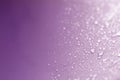 Close up the rain water drops on purple sponge surface as abstract background Royalty Free Stock Photo