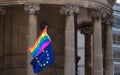 Close up of rainbow LGBT flag and EU flag flying together at the Gay Pride Parade in London 2018. Royalty Free Stock Photo