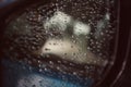 Close-up, raindrops, rain on the car glass, dark sky background, rainy season, abstract, natural background Royalty Free Stock Photo