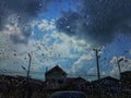 Close-up, raindrops, rain on the car glass, dark sky background, rainy season, abstract, natural background Royalty Free Stock Photo