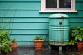 close-up of rainwater barrel with downspout and filter Royalty Free Stock Photo