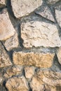 Close up of the original paved pathway, made as asymmetric mosaic of natural stone of different sizes and shapes. Royalty Free Stock Photo