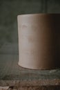 Close-up raw ceramic pottery cup drying on wooden table, clay texture Royalty Free Stock Photo