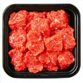 Close up of raw cubed beef in a black plastic container ready for cooking and meal preparation Royalty Free Stock Photo