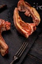 Close-up raw lamb ribs. Halal meat. Raw meat. Lamb rack on a dark rustic background. Salt and spices. Halal food still life Royalty Free Stock Photo