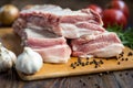Close up Raw Pork Rib meat on Wooden Board with a Jar of Spices Royalty Free Stock Photo