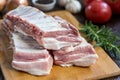 Close up Raw Pork Rib meat on Wooden Board with a Jar of Spices Royalty Free Stock Photo