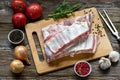 Close up Raw Pork Rib meat on Wooden Board with a Jar of Spices Royalty Free Stock Photo