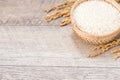 Close up raw rice and unmilled rice in traditions bamboo basket on wooden background, copy spacetext space, blank for text Royalty Free Stock Photo