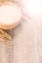 Close up raw rice and unmilled rice in traditions bamboo basket on wooden background, copy spacetext space, blank for text Royalty Free Stock Photo