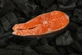 Cooking raw salmon fish steak on charcoal Royalty Free Stock Photo