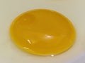 Close image of a raw egg yolk