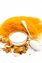 Close up of Raw vermicelli or sevee or seviyan or seviyaan and dry fruits isolated on white with a bowl of milk used to make kheer