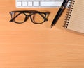 Close up Reading Eye Glasses on Businessman Wooden Table with Ot Royalty Free Stock Photo