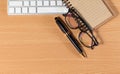 Close up Reading Eye Glasses on Businessman Wooden Table with Ot Royalty Free Stock Photo