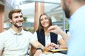 Close up of real estate agent giving keys to couple of customers. Royalty Free Stock Photo