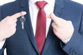 Close-up of real estate agent showing keying and fingers crossed Royalty Free Stock Photo