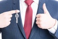 Close-up of real estate agent showing keying and like