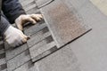 Workman install tile on roof of new house under construction