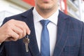 Close-up of realtor or real estate agent holding keys Royalty Free Stock Photo