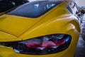 Close-up of Rear light or Tail lamp of Yellow porsche sports car parked in the parking lot Royalty Free Stock Photo