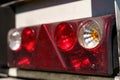 Close-up of the rear light of a truck semi-trailer with a damaged body. Royalty Free Stock Photo