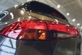 Close up of rear lights detail of modern luxury car with projector lens for low and high beam. Front view of sport Royalty Free Stock Photo