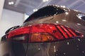 Close up of rear lights detail of modern luxury car with projector lens for low and high beam. Front view of sport Royalty Free Stock Photo