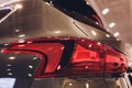 Close up of rear lights detail of modern luxury car with projector lens for low and high beam. Front view of sport Royalty Free Stock Photo