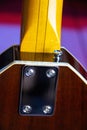 Close up of the rear of a sunburst solid electric bass guitar Vox style Royalty Free Stock Photo