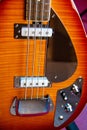 Close up of the rear of a sunburst solid electric bass guitar Vox style Royalty Free Stock Photo