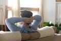 Close up rear view calm man resting on couch Royalty Free Stock Photo