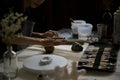 Close-up rear view image of a potter or artist making handcrafted earthenware