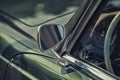 Close up on Rear view mirror on greenv intage car. Royalty Free Stock Photo