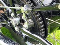 Close up of the rear wheel and drive chain of a black vintage motorcycle Royalty Free Stock Photo