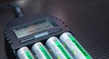 Close up of rechargeable lithium-ion battery with charger