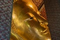 A close up of Reclining Buddha gold statue face. Wat Pho Royalty Free Stock Photo