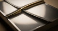 A close-up of a rectangular metal box with a curved gold handle, showcasing its shiny metallic finish and intricate details Royalty Free Stock Photo