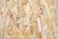 Close up of a recycled compressed light brown wood chippings board textured background. Abstract texture background Royalty Free Stock Photo