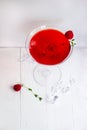 Close-up of red alcohol cocktail with raspberry and thyme on white wood table. Royalty Free Stock Photo