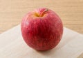 Close Up Red Apple on Wooden Cutting Board Royalty Free Stock Photo