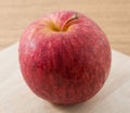 Close Up Red Apple on Wooden Cutting Board Royalty Free Stock Photo