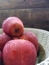 Close up red apples in the basket on the tabble