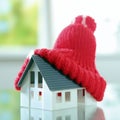 Close up Red bobble hat on Cute Little House Royalty Free Stock Photo
